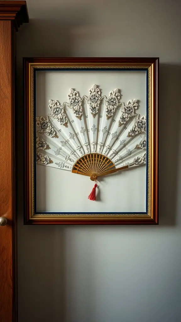 A beautifully framed crystal fan shadow box mounted on a dark wall.