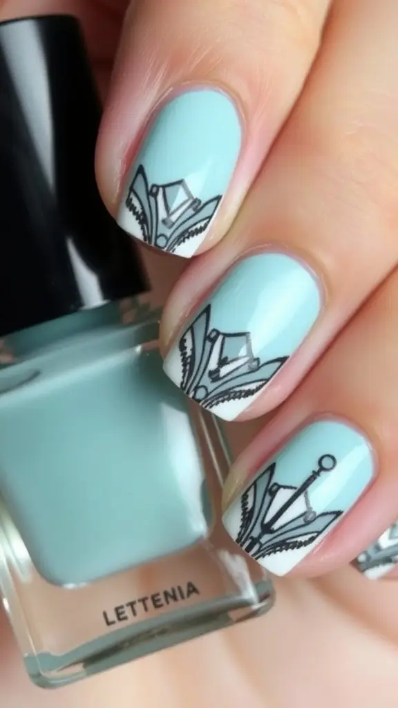 Close-up of short nails featuring Art Deco inspired geometric patterns in black and white.