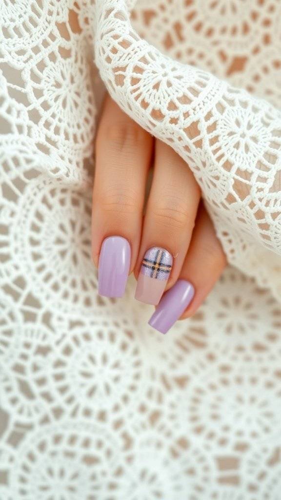 Lavender and dusty rose plaid nail art design on a hand with a lace background