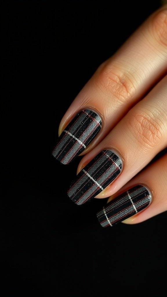 Nails featuring charcoal grey plaid design with red highlights