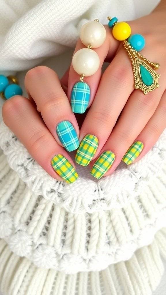 Turquoise and yellow plaid nail art with a statement ring and golden accessories.