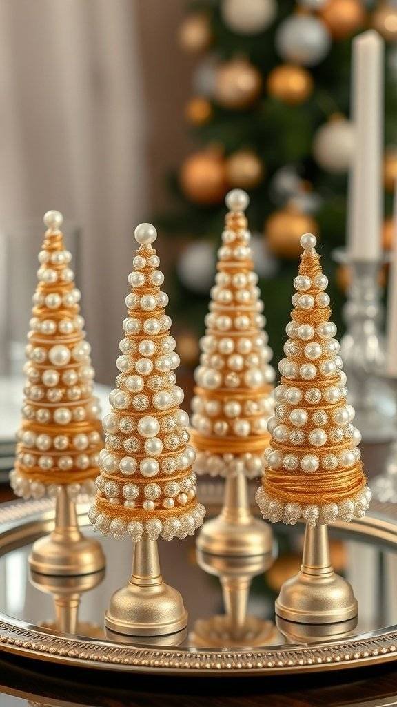 Four opulent pearl tree cones on a mirrored tray, showcasing vintage Christmas decorations.